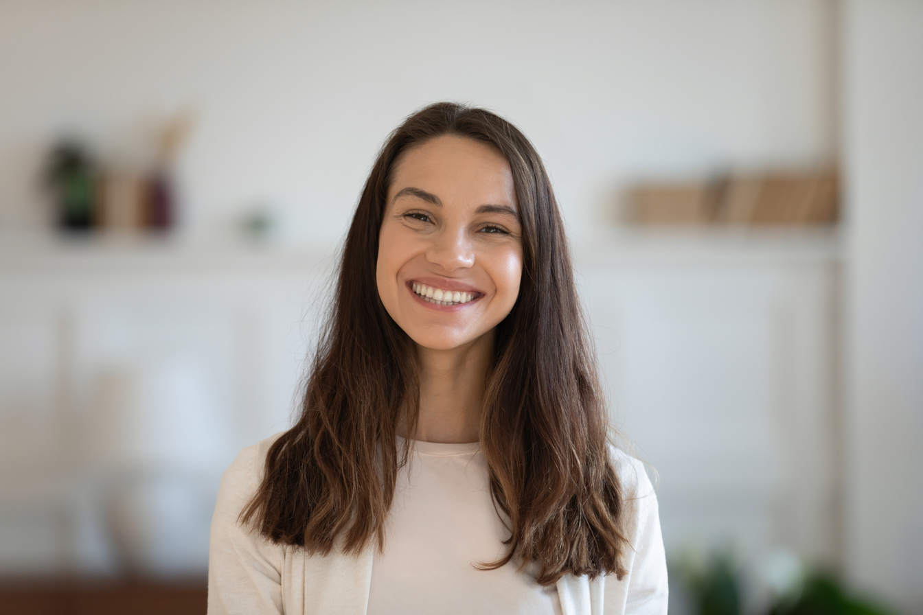 Profile picture of smiling attractive mixed race woman.